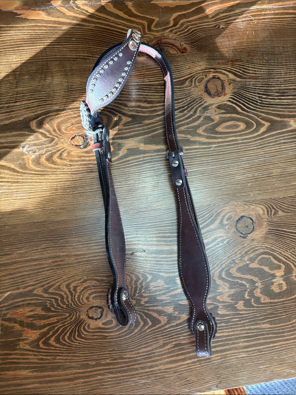 Reddish brown one ear headstall with silver metal detailing